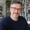 Iain L.